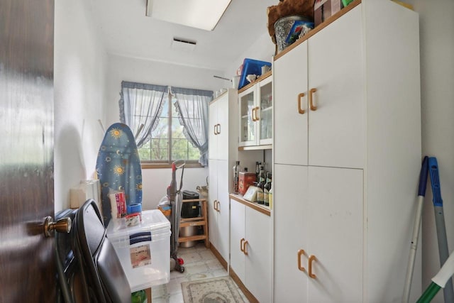 kitchen featuring white cabinetry