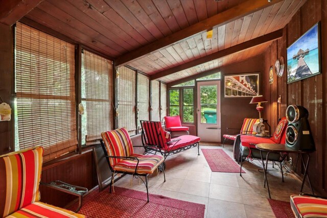 sunroom / solarium featuring wooden ceiling and lofted ceiling with beams