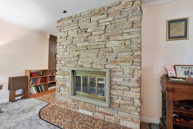 living room featuring a fireplace, crown molding, and carpet