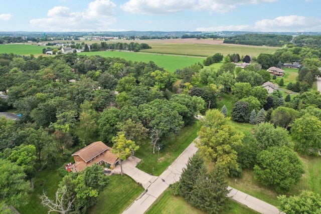 birds eye view of property with a rural view