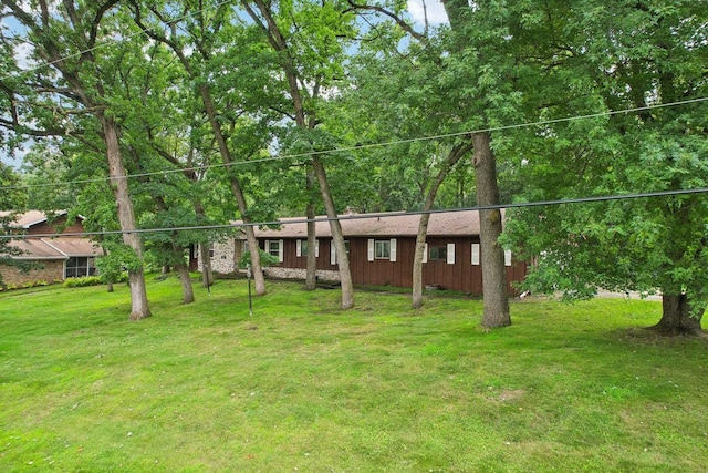 ranch-style house with a front lawn