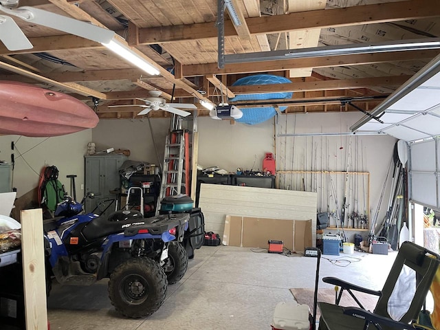 garage with ceiling fan and a garage door opener