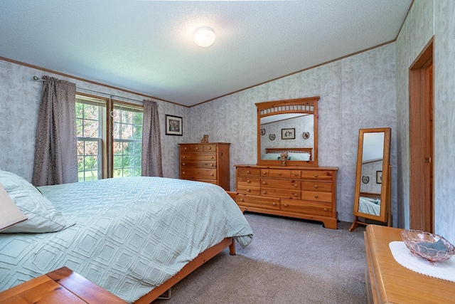 carpeted bedroom featuring ornamental molding and a textured ceiling