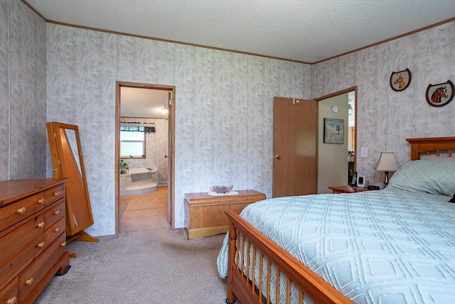 carpeted bedroom with a textured ceiling, crown molding, and ensuite bathroom