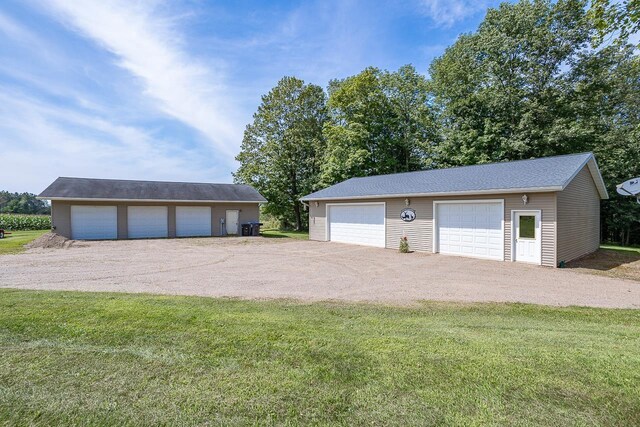 garage with a lawn