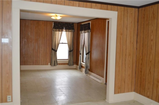 spare room featuring wood walls