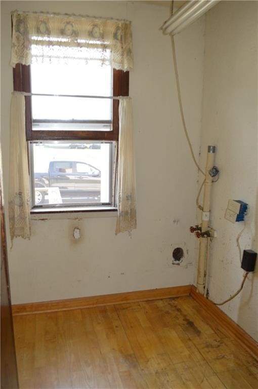 laundry room featuring hardwood / wood-style floors