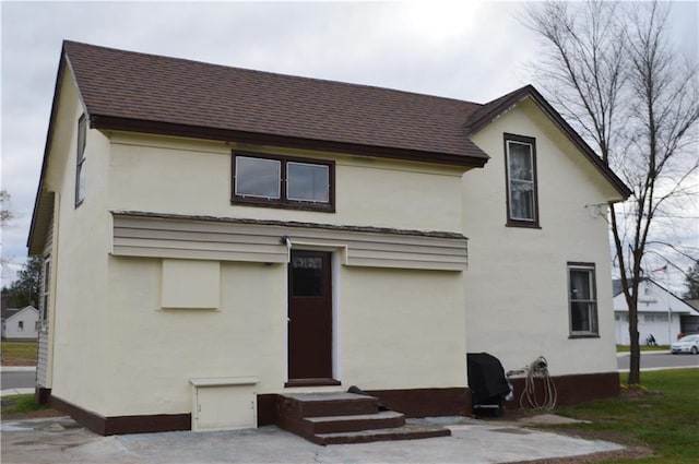 rear view of house with a patio