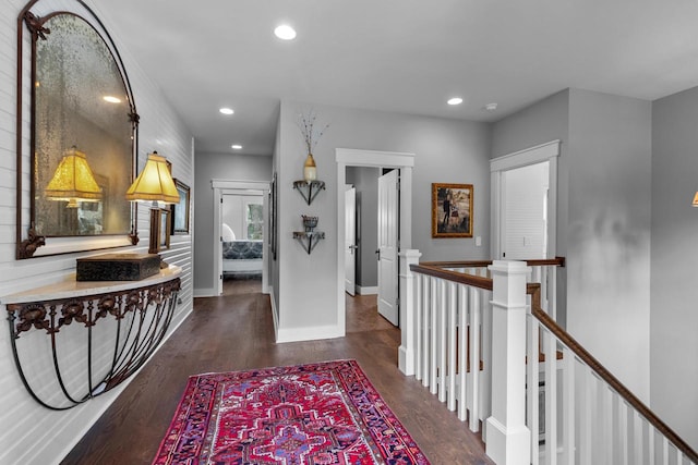 hallway with dark hardwood / wood-style floors