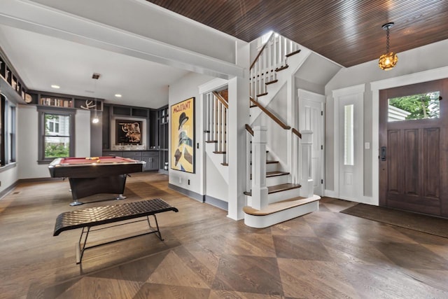 entrance foyer with billiards and dark wood-type flooring