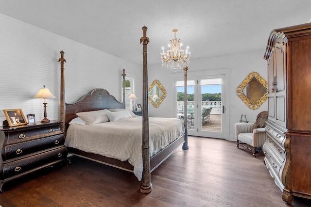 bedroom with dark wood-type flooring, access to exterior, and a notable chandelier