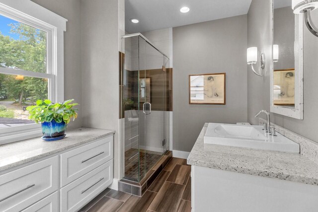 bathroom with vanity and walk in shower