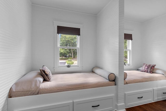 bedroom with dark wood-type flooring