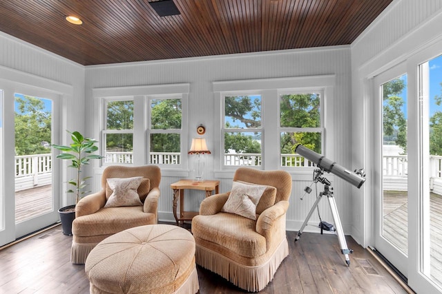 sunroom with plenty of natural light and wooden ceiling