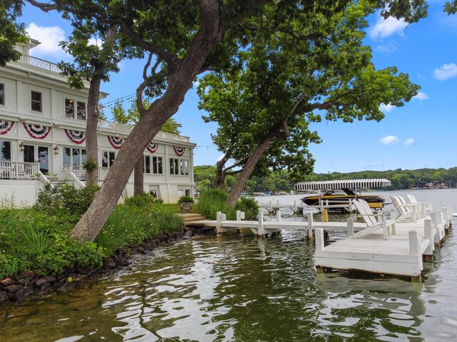 wooden terrace with a water view