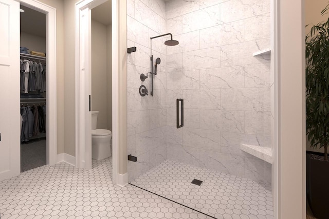 bathroom featuring an enclosed shower and toilet