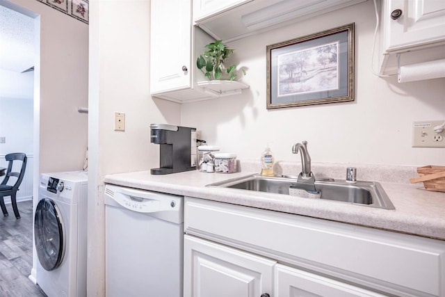 kitchen with dishwasher, white cabinetry, washer / dryer, and hardwood / wood-style flooring