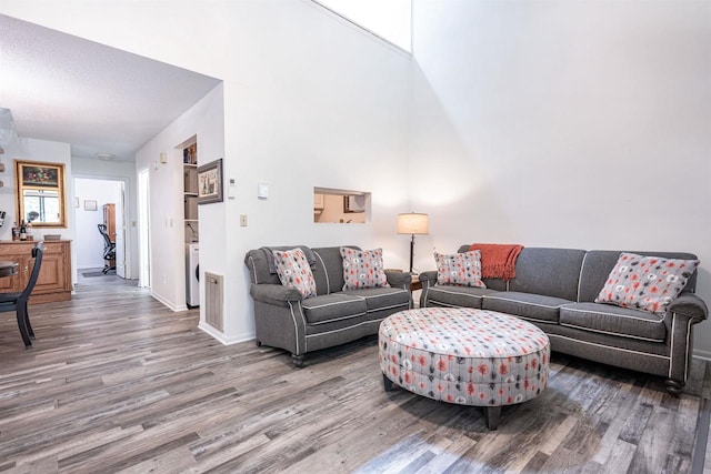 living room with hardwood / wood-style floors and washer / clothes dryer