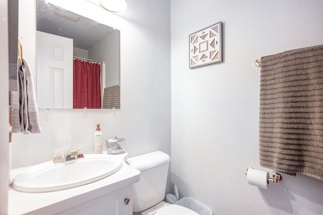 bathroom with vanity and toilet