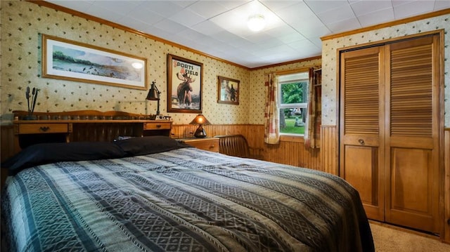 12810 N County Highway T, Hayward, WI 54843 - bedroom with ornamental molding, light carpet, and a closet