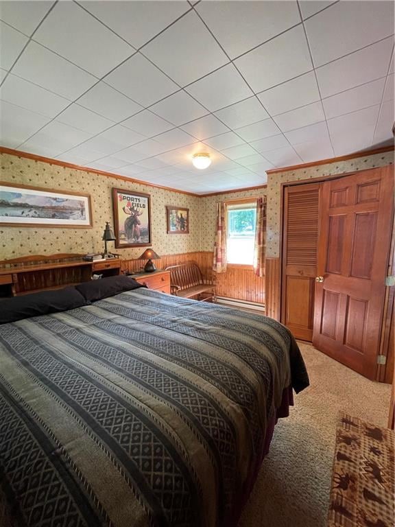 bedroom with carpet floors and baseboard heating