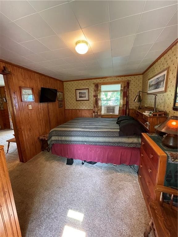 carpeted bedroom featuring wooden walls and cooling unit