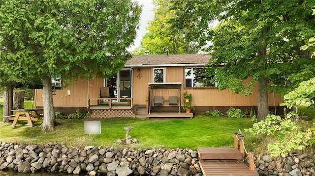 12810 N County Highway T, Hayward, WI 54843 - rear view of property with a lawn and a deck