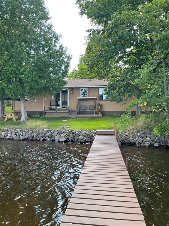 dock area with a patio area and a lawn