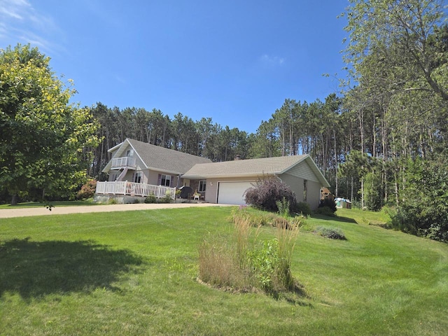 single story home with a garage and a front yard