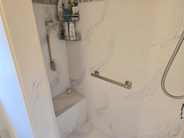 bathroom featuring tile patterned floors and a shower