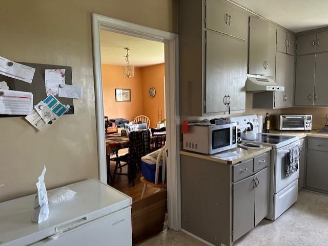 kitchen with white electric range