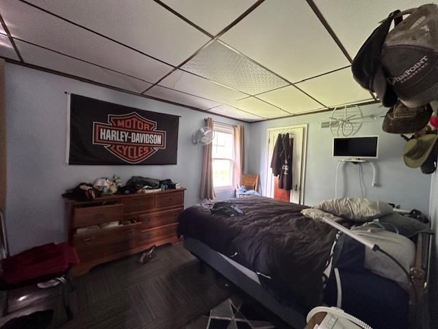 bedroom featuring a drop ceiling