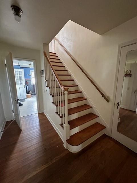 stairs with wood-type flooring