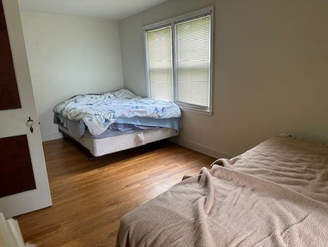 bedroom featuring dark wood-type flooring