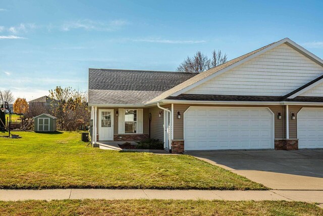 view of front facade featuring a garage and a front lawn