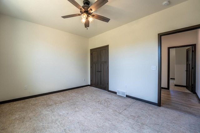 unfurnished bedroom featuring ceiling fan and light tile patterned flooring