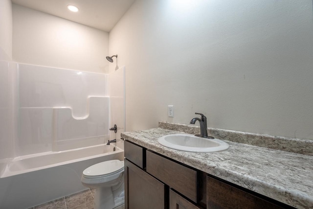 full bathroom with bathtub / shower combination, tile patterned floors, toilet, and vanity