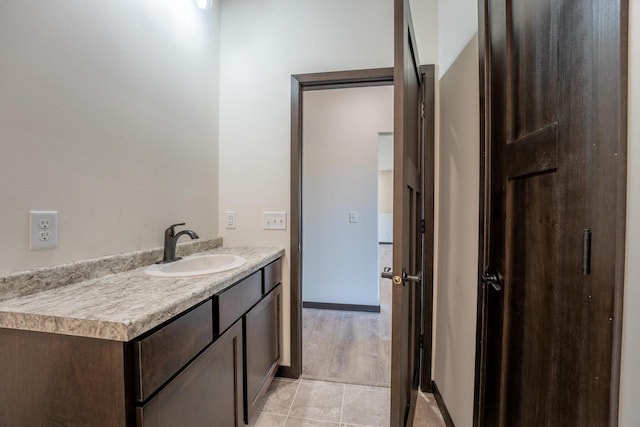 bathroom featuring hardwood / wood-style floors and vanity