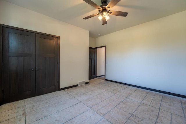 unfurnished bedroom with ceiling fan, a closet, and light tile patterned flooring