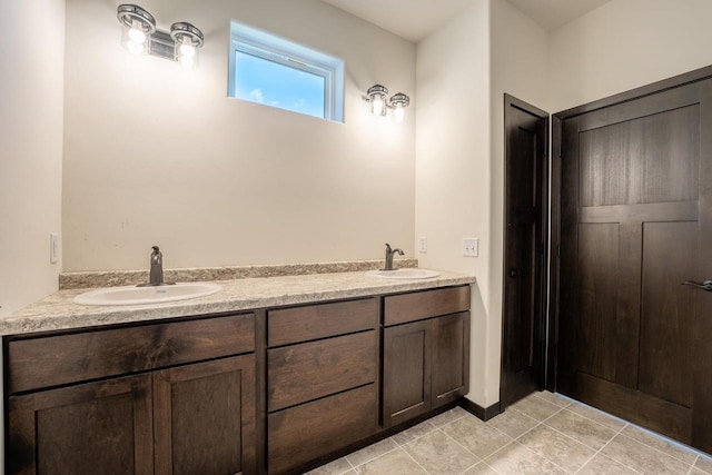 bathroom with tile patterned flooring and vanity