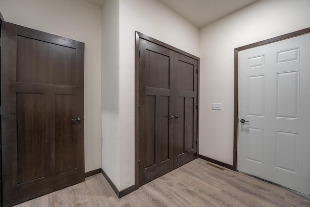 entryway with light hardwood / wood-style flooring