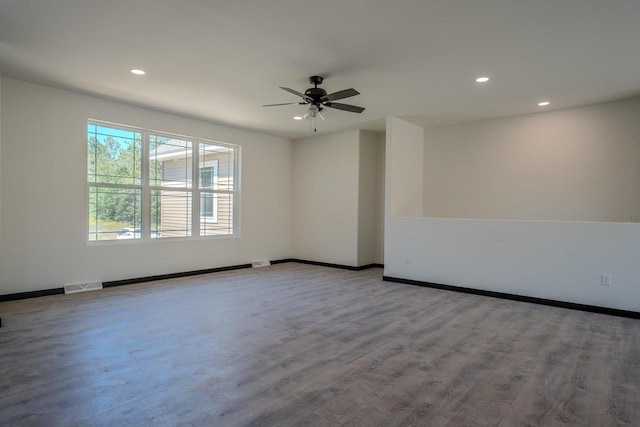 unfurnished room featuring hardwood / wood-style flooring and ceiling fan