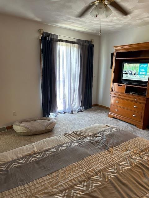 unfurnished bedroom featuring light carpet and ceiling fan