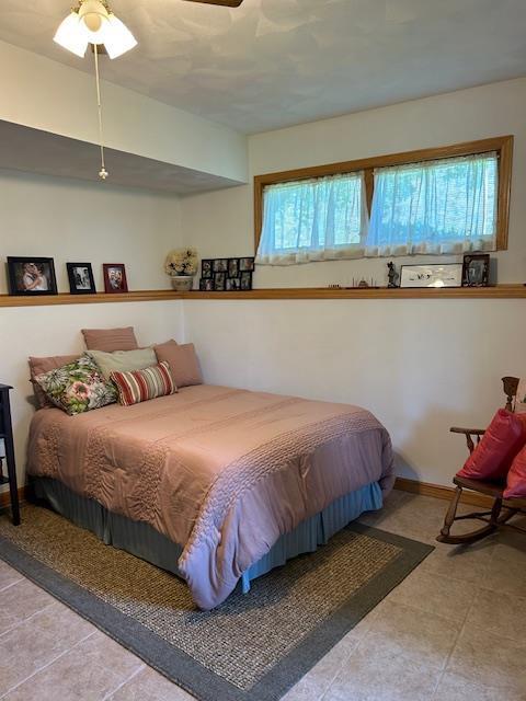 bedroom with multiple windows