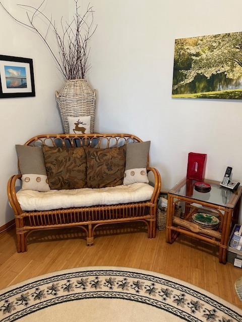 sitting room with hardwood / wood-style floors