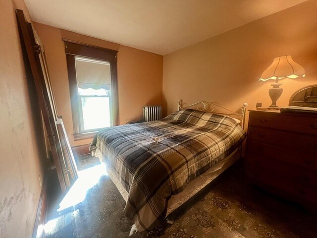 bedroom featuring radiator