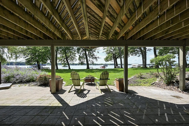 view of patio with a water view