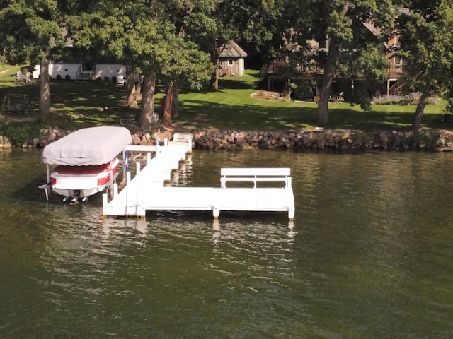 dock area featuring a yard and a water view