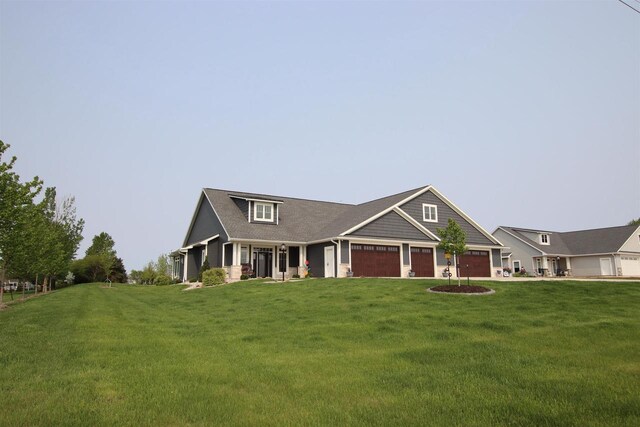 view of front facade with a garage and a front yard