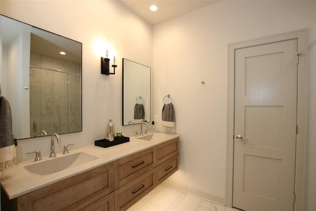 full bathroom with double vanity, a tile shower, recessed lighting, marble finish floor, and a sink